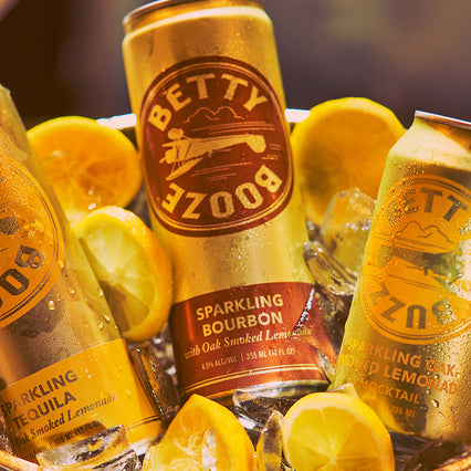 Betty Booze Bourbon Lemonade Can with Lemons